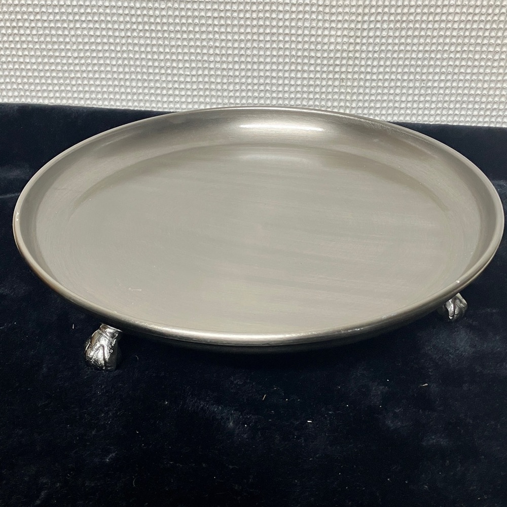 Metal footed serving plate